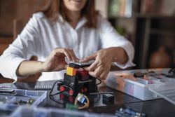 Woman assembling an electric machine