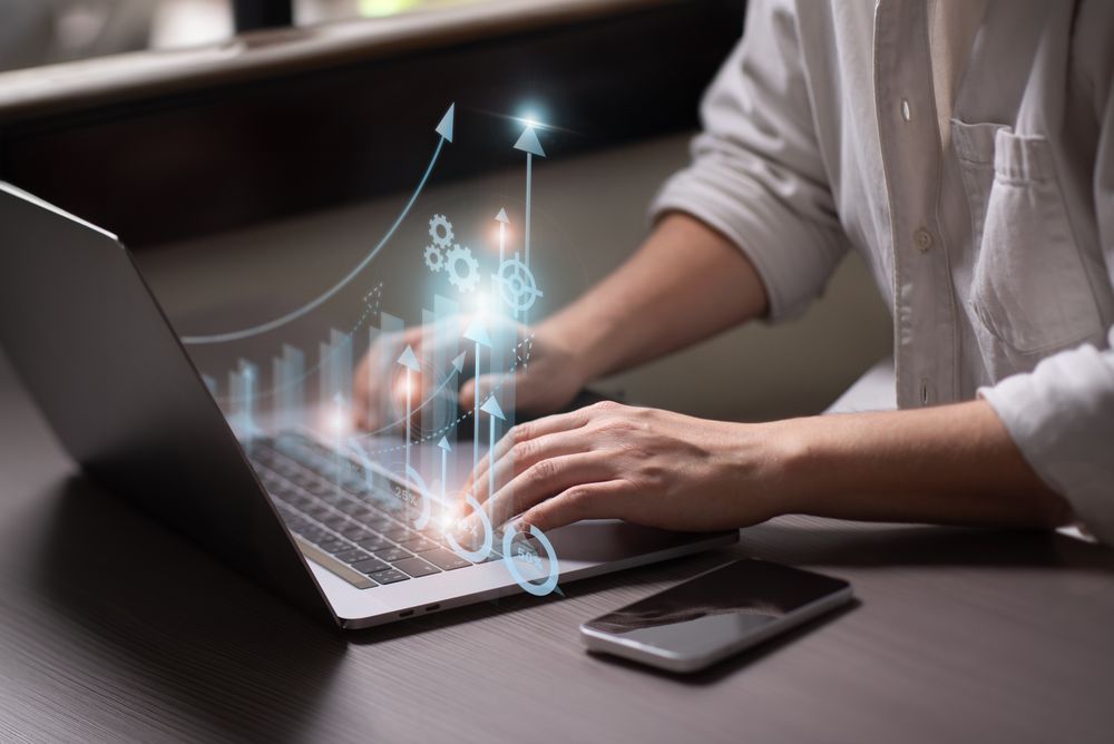 Businessman doing financial analysis on laptop