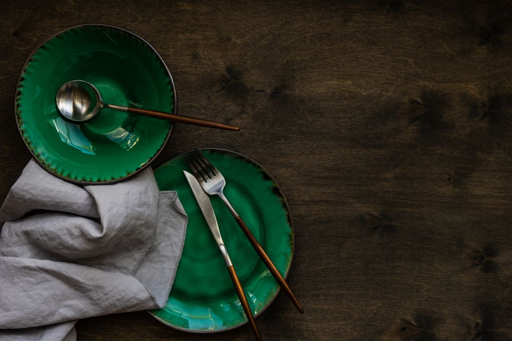 Rustic table setting with bright green ceramic plates