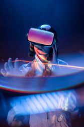 Woman touching air in VR glasses