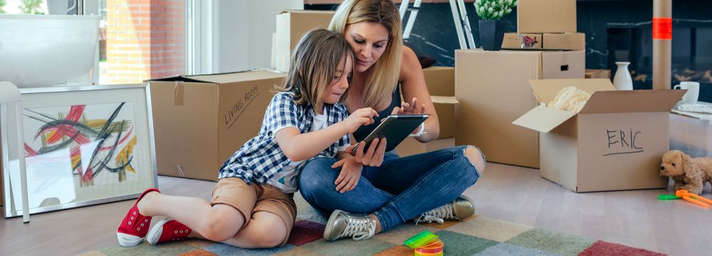 Mother and son playing the tablet