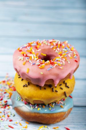 Delicious assorted colorful donuts on the table.