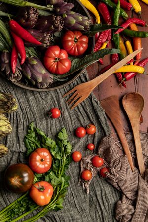 Assorted vegetables and napkins on table