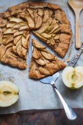 Biscuit with apples on parchment paper
