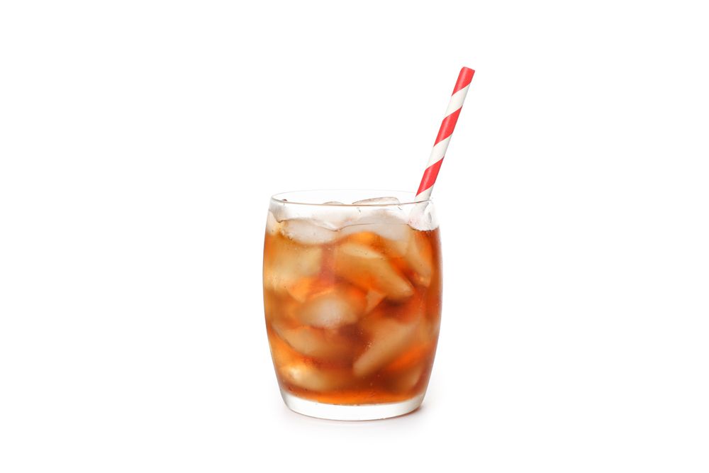 Glass of cold cola isolated on blank background