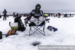 Nisswa, MN, USA - January 25th, 2020: A female competitor at an ice fishing tournament 5Q89n0
