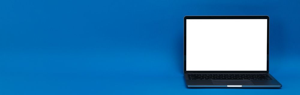 Banner of blue room with laptop with mockup screen