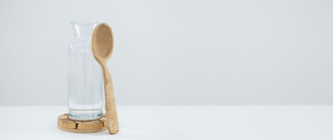 Wooden spoon and water bottle