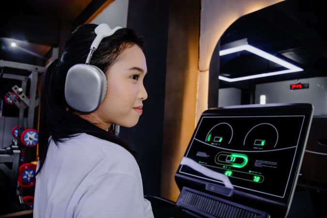 Focused treadmill workout with sleek headphones