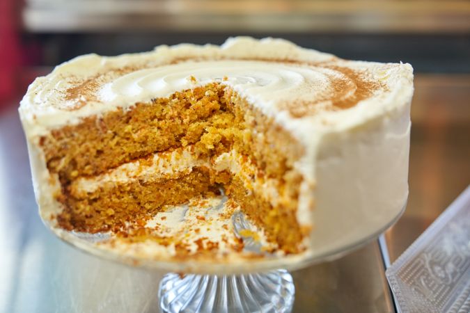Sliced cake placed on glassware on table