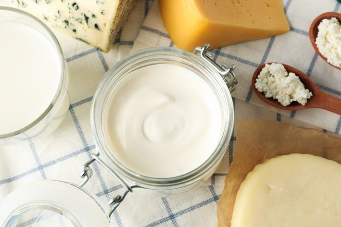 Fresh dairy products on kitchen towel, close up