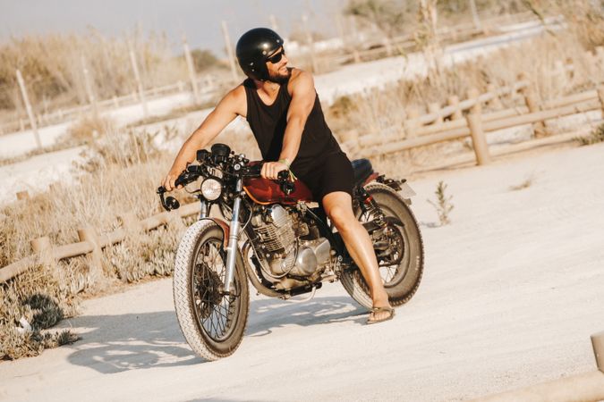 Confident male driving motorcycle