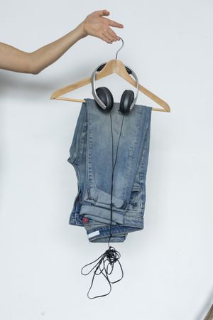 Jeans and headphones on hanger