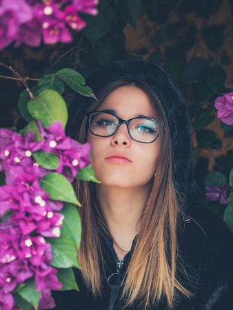 Woman on background of stunning violet flowers