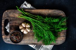 Breadboard with seasonings and garlic