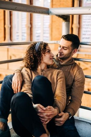 Happy couple hugging in pavilion