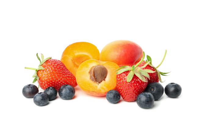 Tasty strawberry, apricot and blueberry isolated on plain background