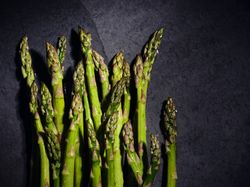 Green asparagus on gray marble surface