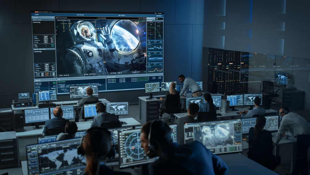 Space Mission Control Room Monitors Astronaut's Spacewalk.