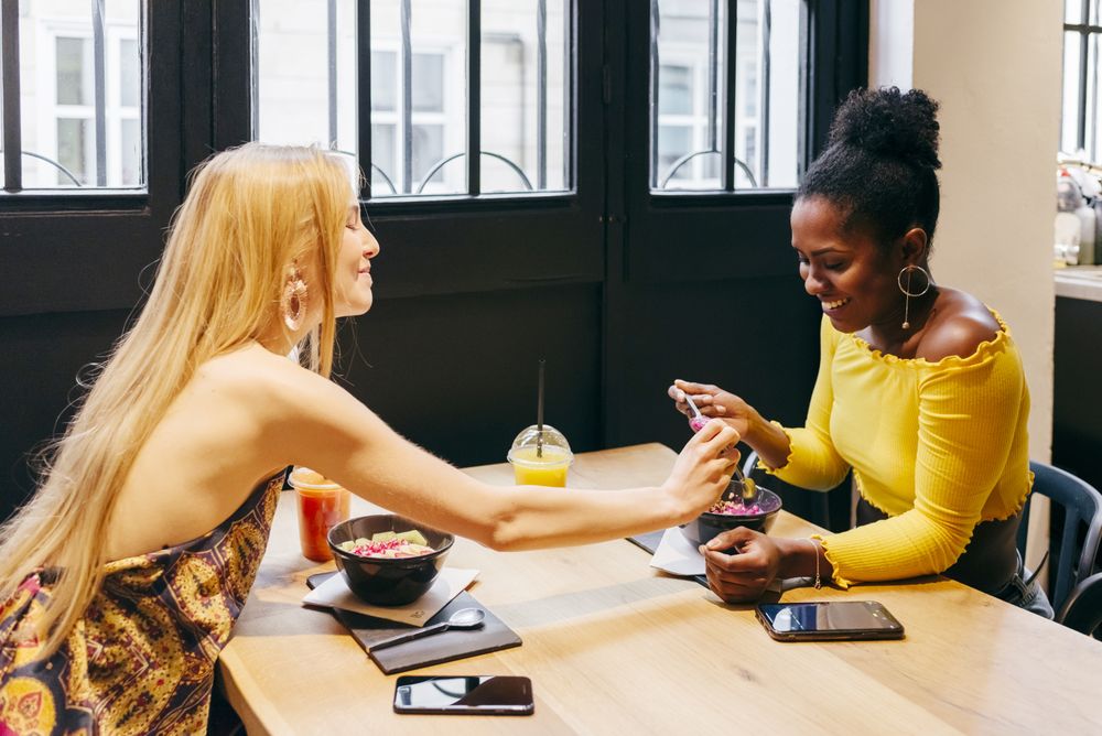 friends having conversation at cafe