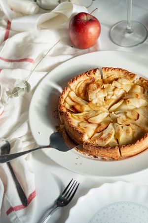 Freshly baked apple tart sliced and ready to serve
