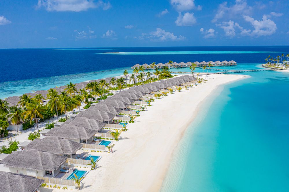 A row of holiday villas lining the beach waterfront