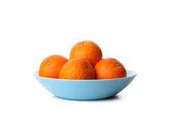 Plate with ripe mandarins isolated on light background