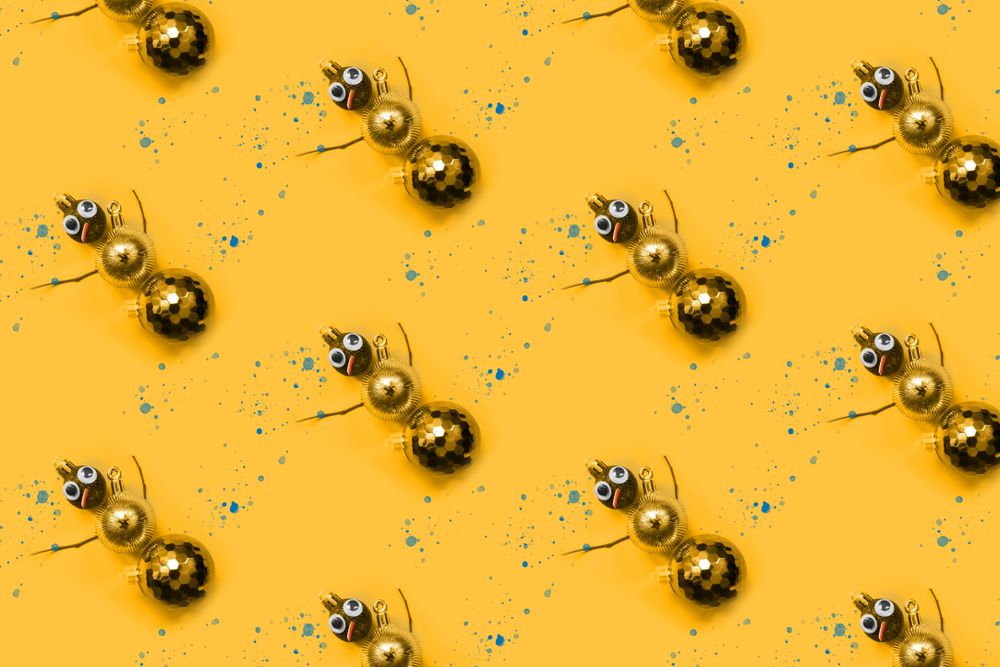 Rows of gold bauble snowman with splashes paint