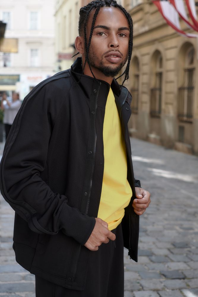 Black male standing on the street