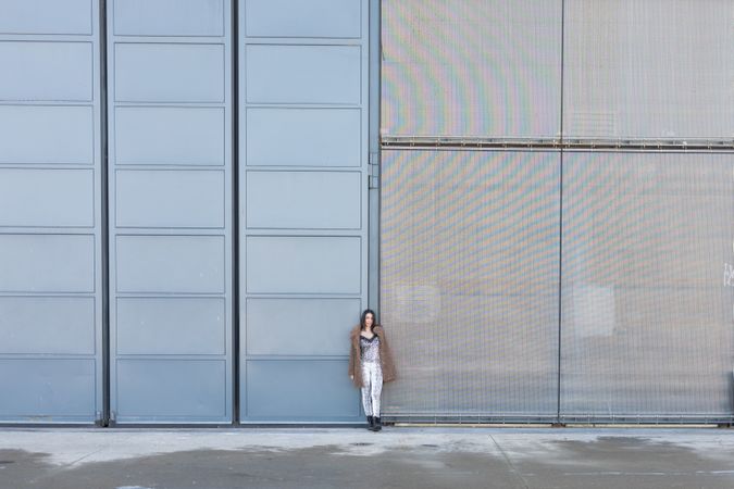 Trendy female near modern buildings