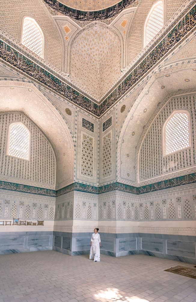 Unrecognizable tourist inside ancient building