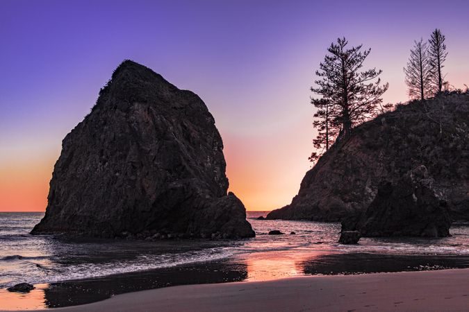Beach at sunset with beautiful purple orange sky