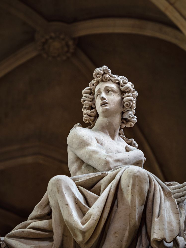 Ancient sculpture in one of the churches of Paris. Antique art.