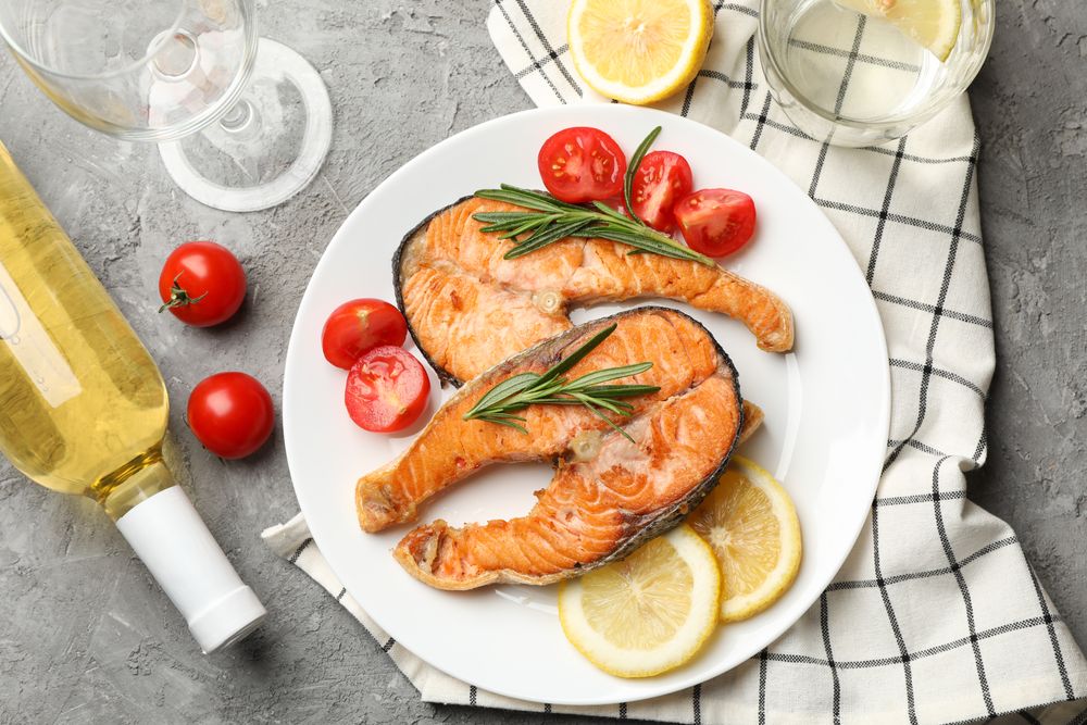Composition with tasty grilled salmon on gray background, top view