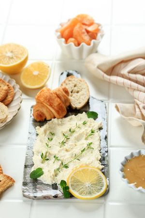 Butter Board Topped with Fresh Herbs, Lemon Zest, Parmesan Cheese with Biscuit