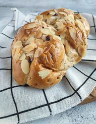 Freshly baked cranberry and cheese bread with almond slices on top