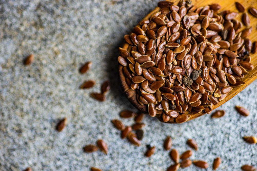 Vintage wooden spoon with flax seeds