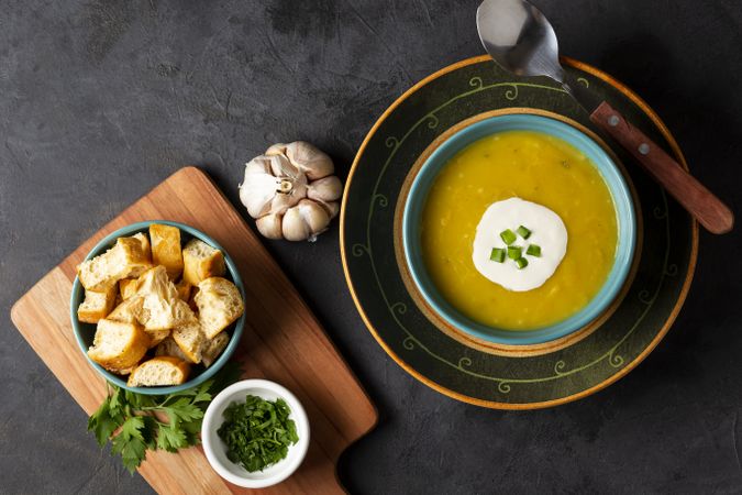 Bowl with pumpkin soup on the table.