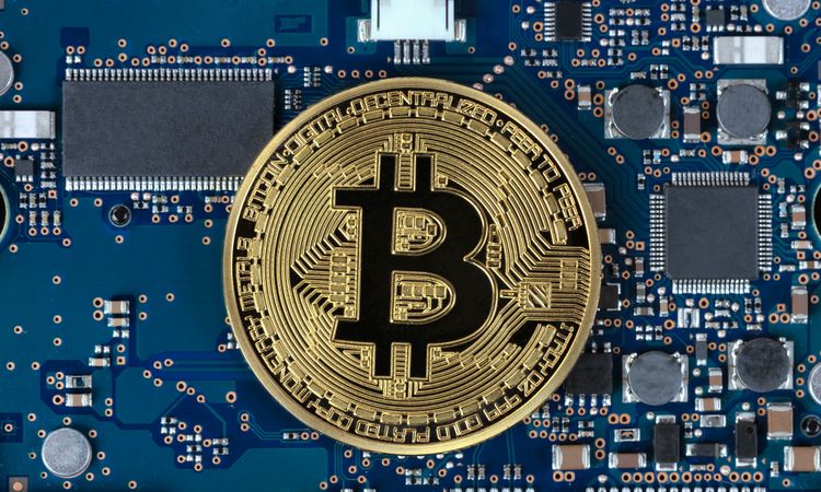 Bitcoin with computer circuit board in background for future currency concept