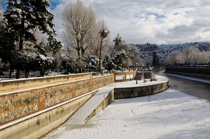 River after snow storm in Granada, Spain