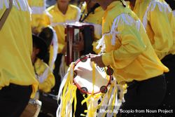 Group of men in yellow outfits playing music at religious festival in Minas Gerais, Brazil 41vOOb