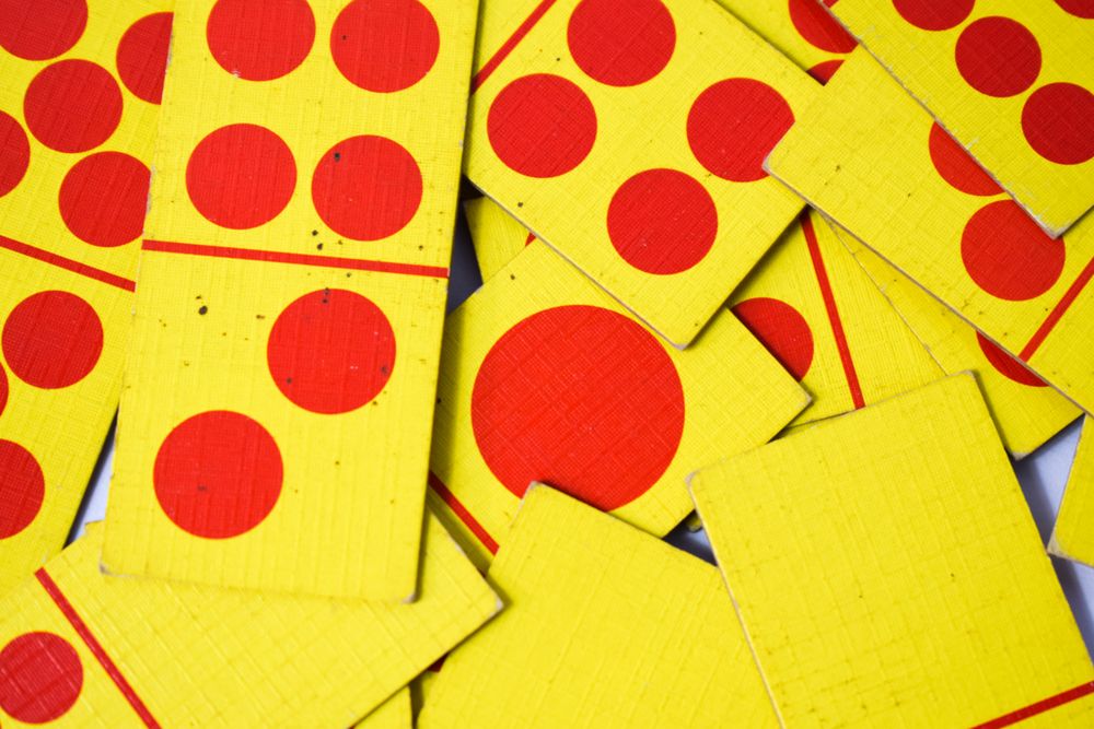 Top view of colorful scattered domino cards