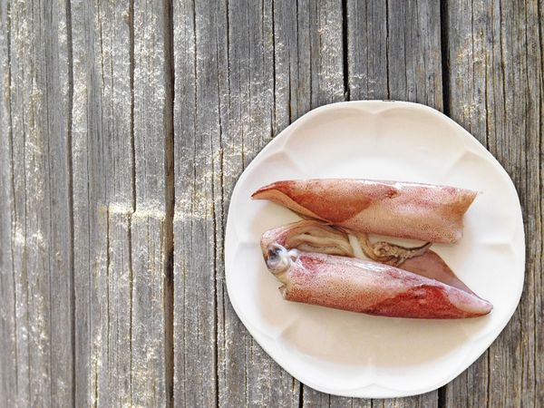 Squid On Wooden Background