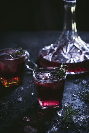Glasses and carafe with red wine on table