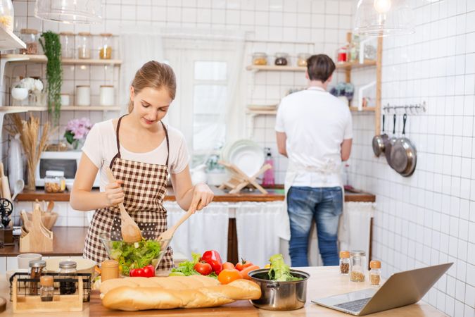 Couple learning to cook in the kitchen at home