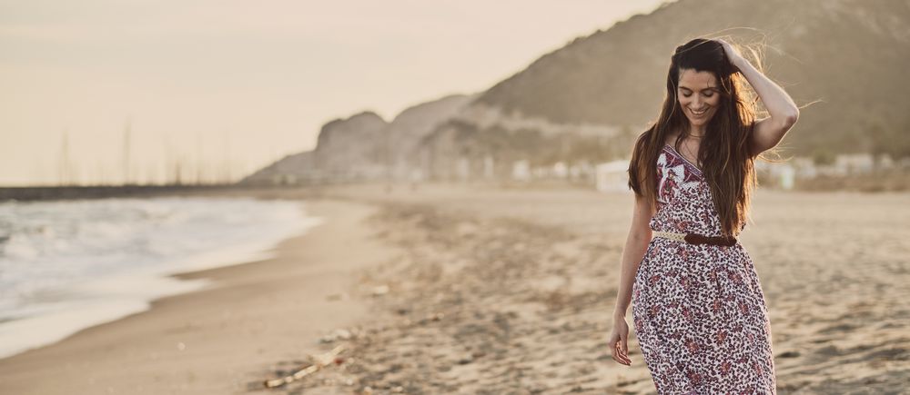 Woman with dress at the beach