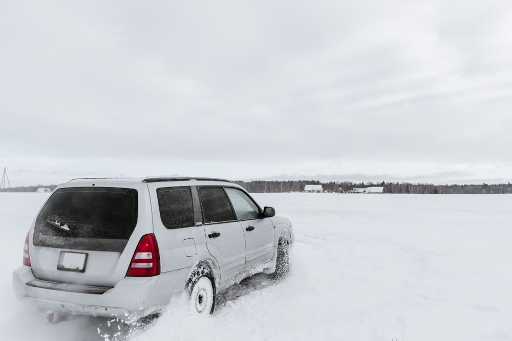 Car driving on snow field