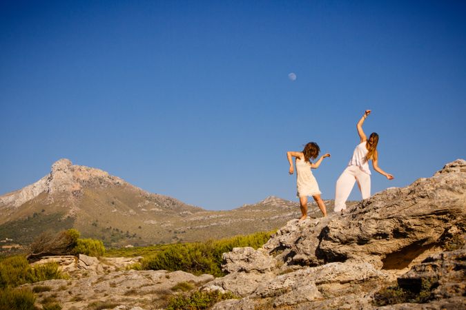 Young women posing on stones