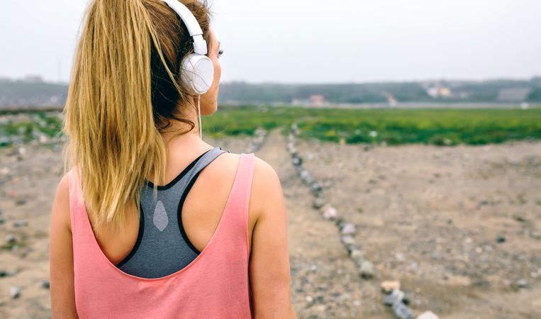 Young sportswoman watching the way