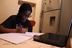 School girl studying at home